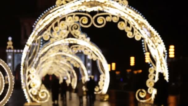 Big illuminated arcs,light tunnel with snowflakes — Stock Video
