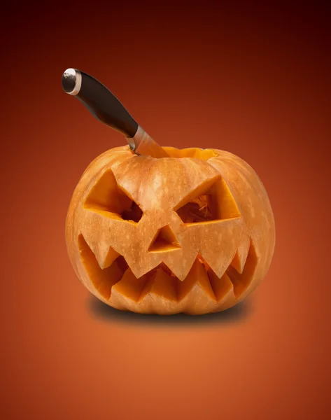 Knife in the pumpkin head — Stock Photo, Image