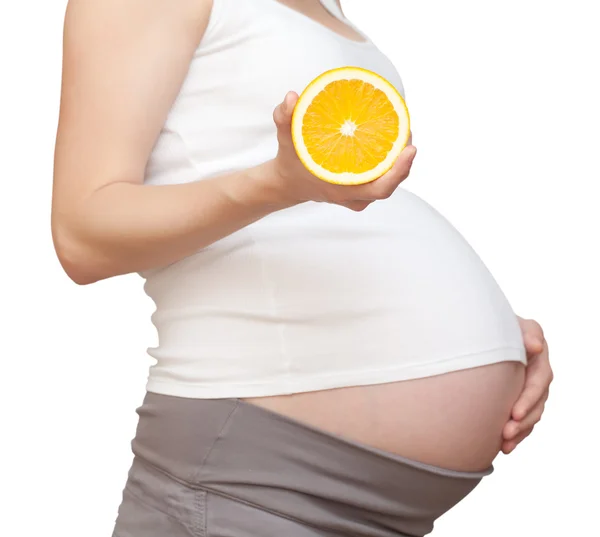 Mulher grávida e laranja — Fotografia de Stock