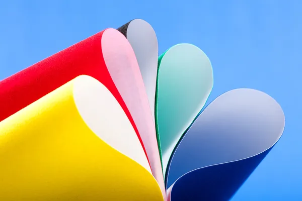 Background macro image of colored curved sheets of paper — Stock Photo, Image