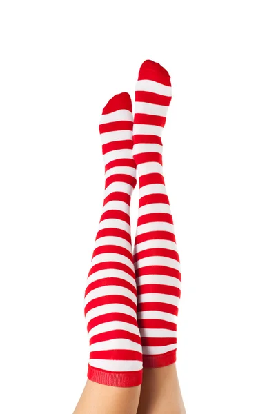 Legs long female in striped socks isolated on white background — Stock Photo, Image