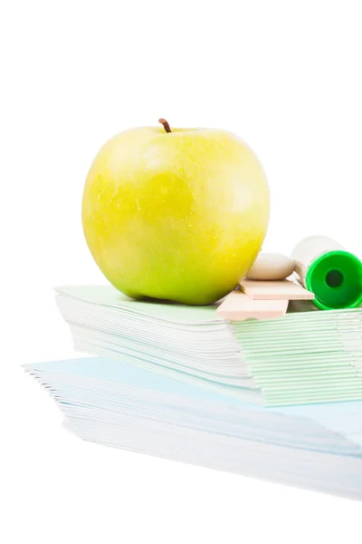 Apples and study stuff over white background — Stock Photo, Image