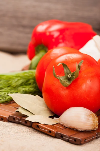 Fresh tomatoes on a background wooden boards — Stock Photo, Image