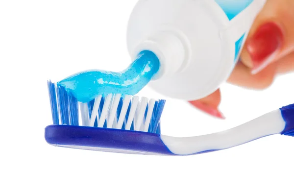 Brosse à dents avec pâte à dents sur fond blanc — Photo