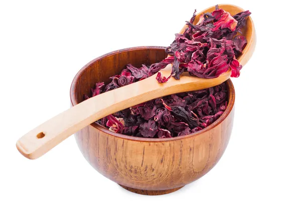 Bowl of aromatic Hibiscus tea with wooden spoon — Stock Photo, Image