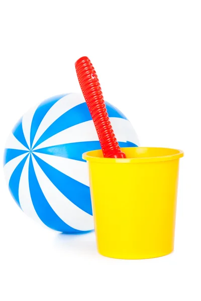 Beachball with sand and bucket for the beach — Stockfoto