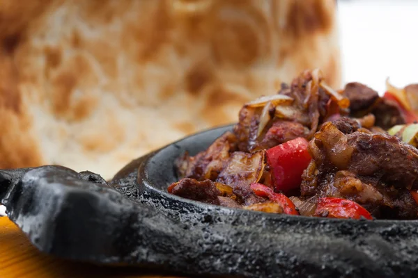 Meat on a roasting pan and pita — Stock Photo, Image