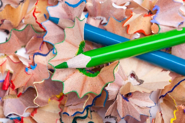 Colored pencil shavings and sharpener — Stock Photo, Image