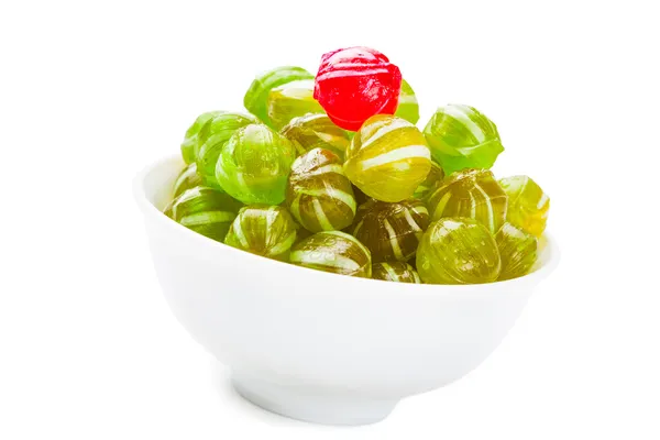 Ball shaped candy in bowl isolated on white — Stock Photo, Image