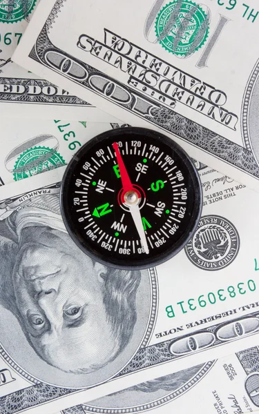 Dolarů a kompas — Stock fotografie
