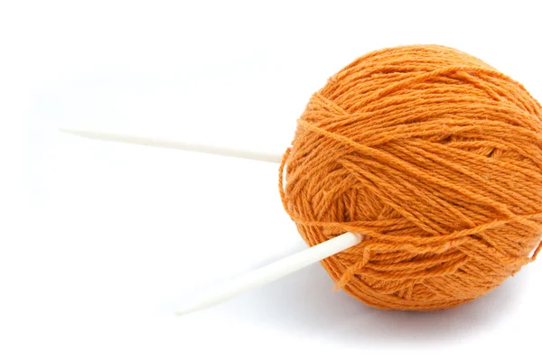 Orange clew and needle — Stock Photo, Image