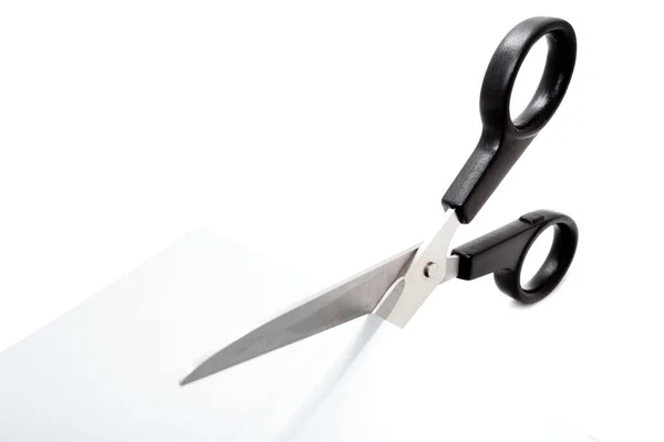 Scissors cutting a paper — Stock Photo, Image