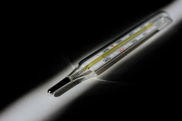 Thermometer on black — Stock Photo, Image