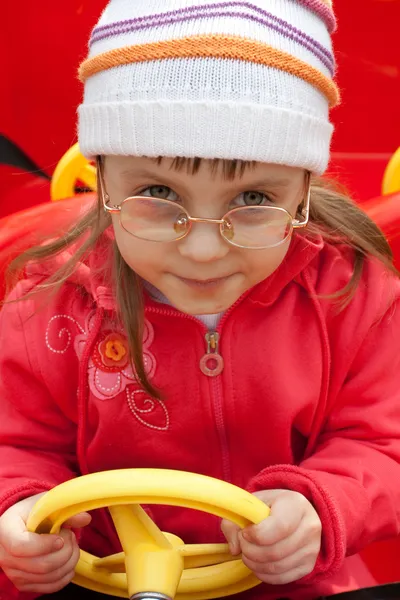 Girl in red car — Stock Photo, Image