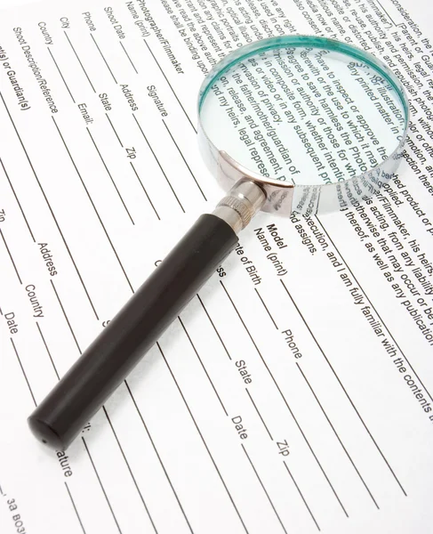 Magnifying glass and text — Stock Photo, Image