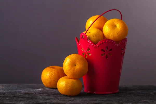 Tangerines in a bucket — Stock Photo, Image