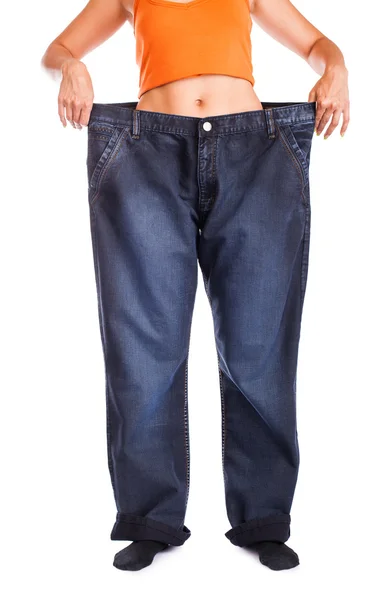 Slim meisje in grote jeans — Stockfoto