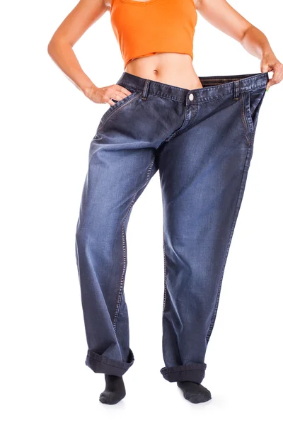 Slim meisje in grote jeans — Stockfoto