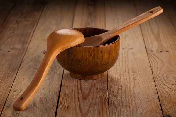 Wooden plate and spoons — Stock Photo, Image