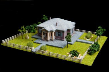 siyah bir arka plan bir ev modeli