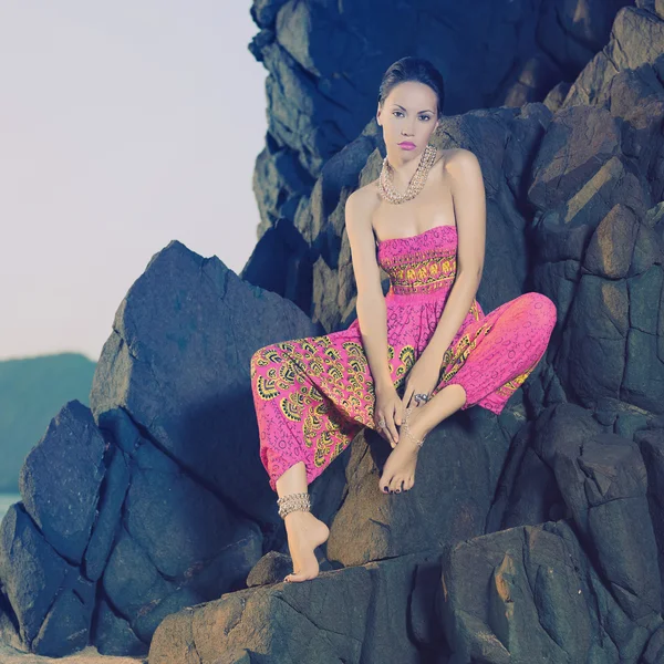 Glamorous beauty on rocky shore — Stock Photo, Image