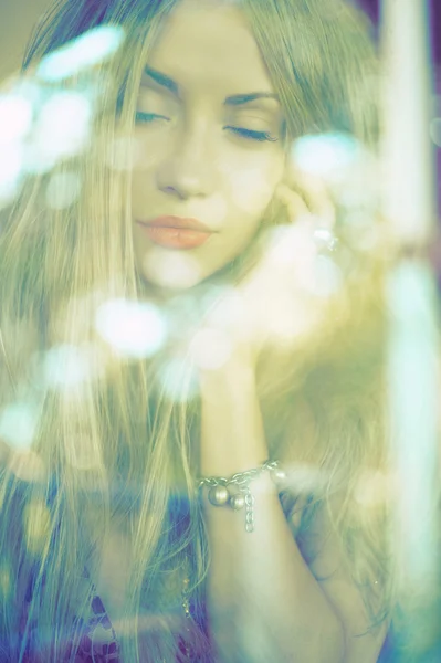 Beautiful lady through the glass — Stock Photo, Image