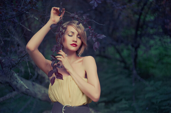 Photo of young beautiful lady in fairy forest