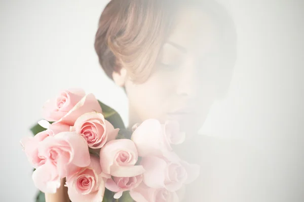 Charming lady with roses — Stock Photo, Image