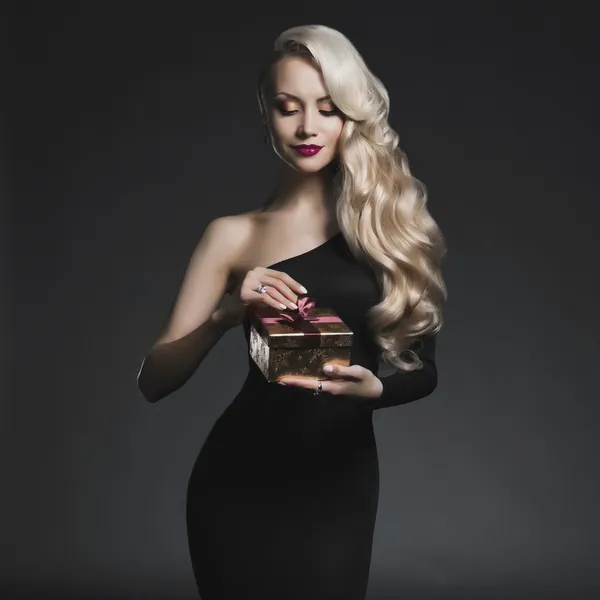 Luxury blonde with a Christmas gift — Stock Photo, Image