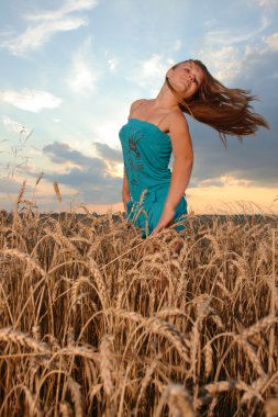 Girl with casual style wear against sunset sky