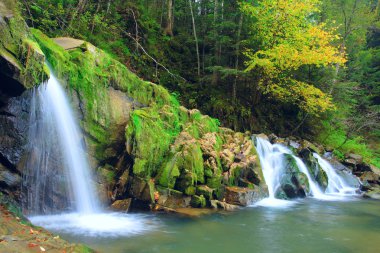 Autumn waterfall in Carpaty mountain