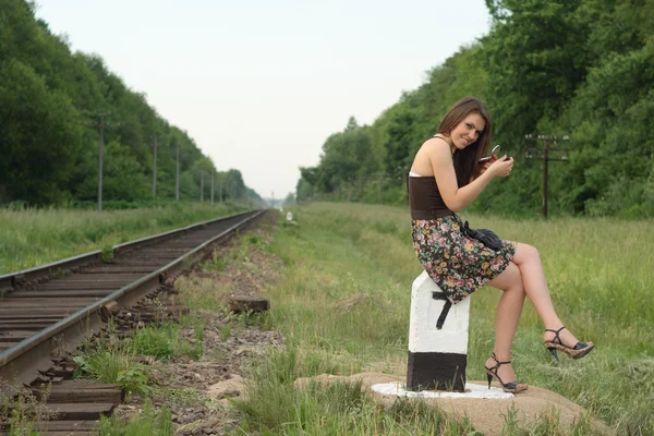 Pretty girl near railroad — Stock Photo, Image