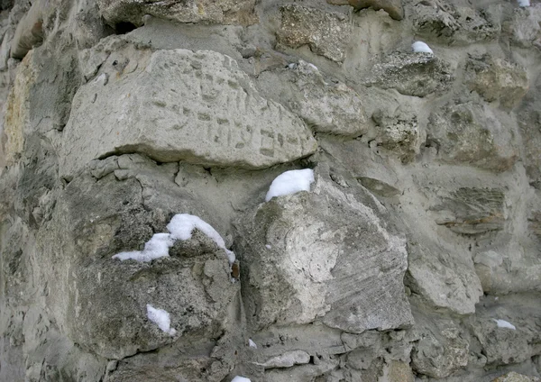 Piece of jewish tombstone in wall