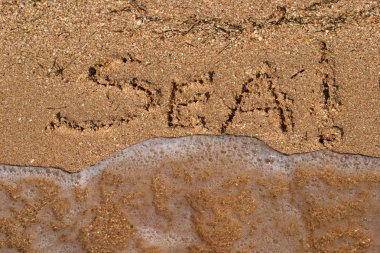 yazıtlar üzerine kum