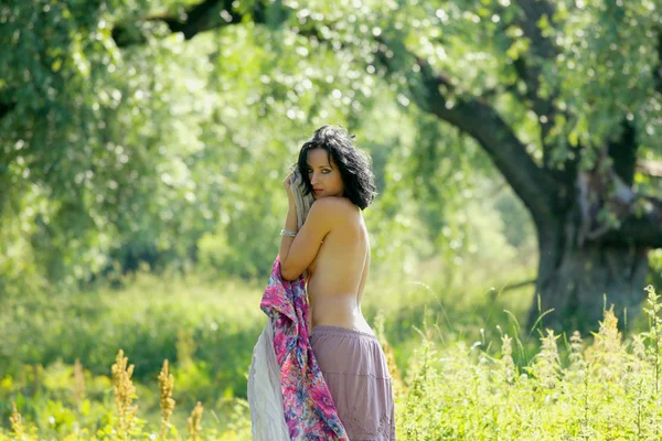 Nice woman near river — Stok fotoğraf