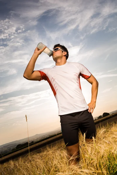 Jogging through the fields — Stock Photo, Image