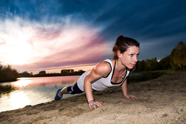 Stretching woman — Stock Photo, Image