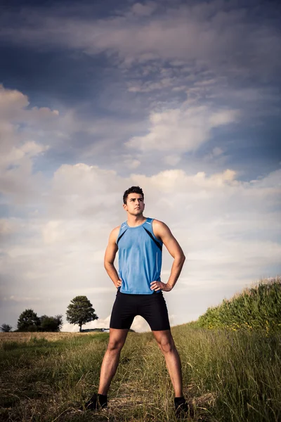 Jogging through the fields — Stock Photo, Image