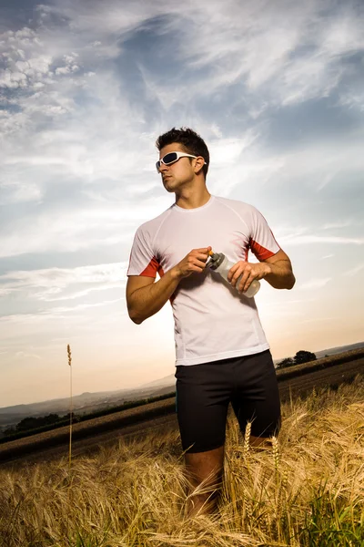 Jogging through the fields — Stock Photo, Image