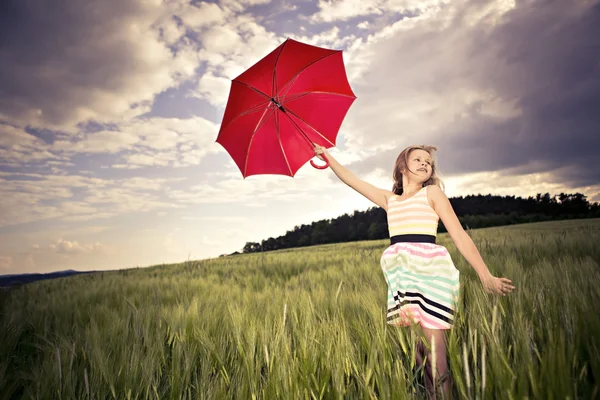 Pulando menina com guarda-chuva — Fotografia de Stock