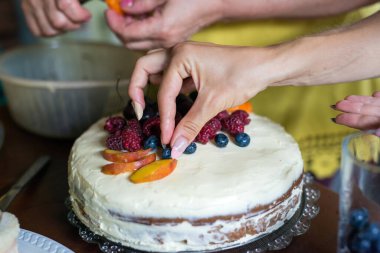 Preparing a fruit cake for a birthday - selective focus