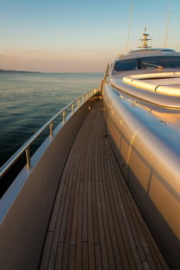 Beautiful sea view from the left board of a luxury yacht at sunset / sunrise - vertical orientation
