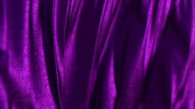 Menekşe kumaş kıvrımları rüzgarda sallanıyor. Doku. Yakın plan. 3d canlandırma