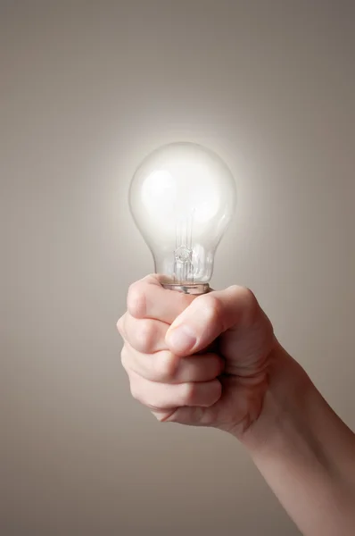 Hand with light bulb — Stock Photo, Image