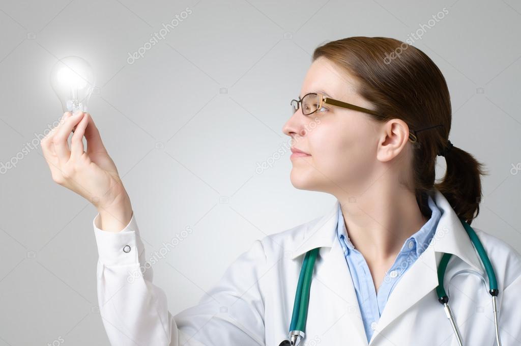 Doctor with glowing light bulb