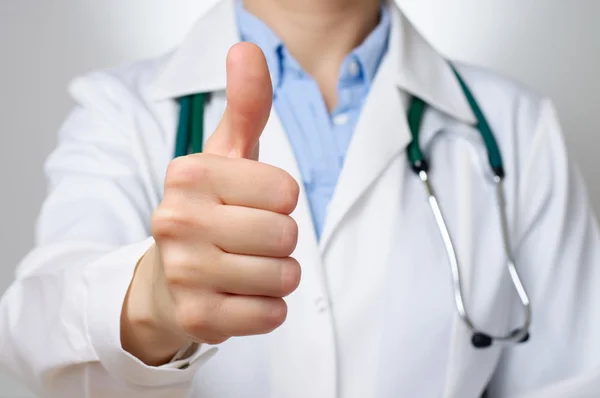 Doctor with thumbs up gesture — стоковое фото