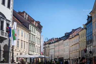 LJUBLJANA, SLOVENIA - JUNE 14, 2021: typical baroque and medieval building facades in mestni trg square, one of the main pedestrian streets of the city center of the historical street