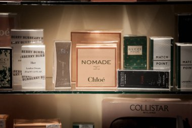 BELGRADE, SERBIA - FEBRUARY 21, 2021: Nomade Chloe logo on their perfume Absolu de Parfum seen in a window of a luxury shop surrounded by other brands. Chloe is a French fragrance, fashion and cosmetics brand