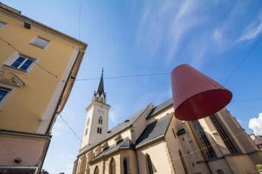 Focus on Stadtpfarrkirche Sankt Jakob, the parish church of saint jacob, in the city center of Villach, in Carinthia, Austria, a catholic church in the city center