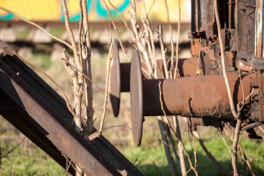 Selective blur on old vintage train buffers, on a railroad wagon, abandoned and neglected, whichis used to protect the carriage from bumps.